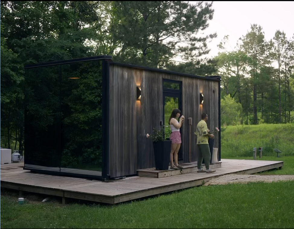 Modern AirBnB tiny cabin in the woods at golden hour